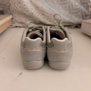 Skechers women’s grey and gold sneakers